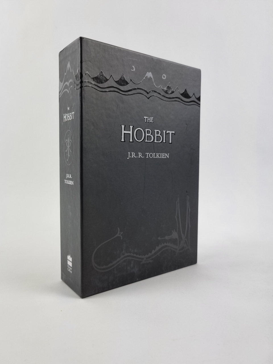 The Boxed set contains a copy of the Hobbit, as well as 8 postcards depicting the maps, color illustrations and the dustjacket from the book